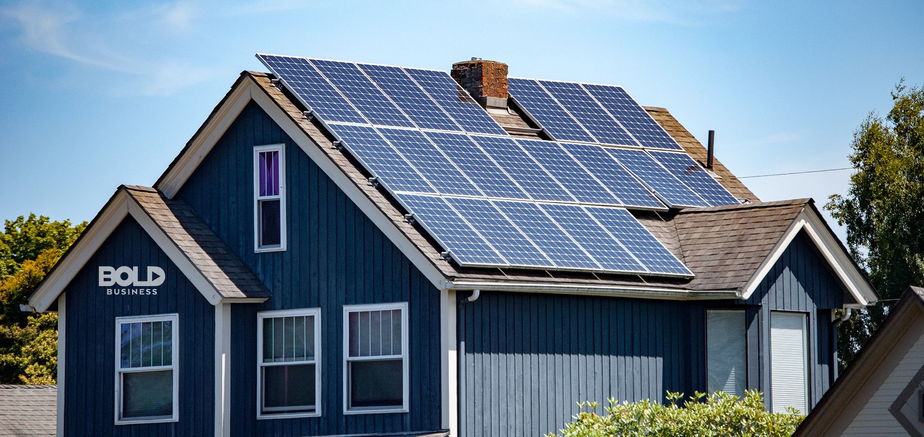 a photo containing a digital rendering of Tesla rooftop solar shingles on a house