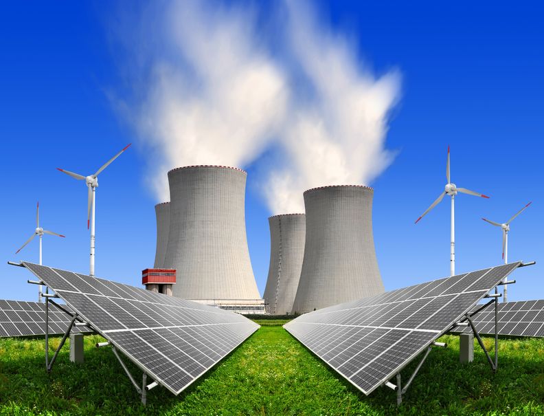 a photo of solar panels beside a fossil fuel factory and four wind turbines amid the ongoing discussion about solar energy vs fossil fuels