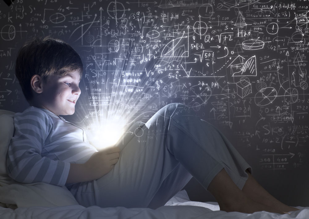 a photo of a kid looking at a tablet in bed, with mathematical concepts surrounding him, depicting the reality of digital technology in education