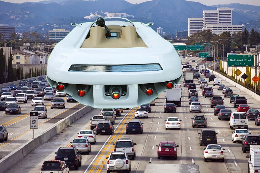 A car flying over a traffic jam in Los Angeles.