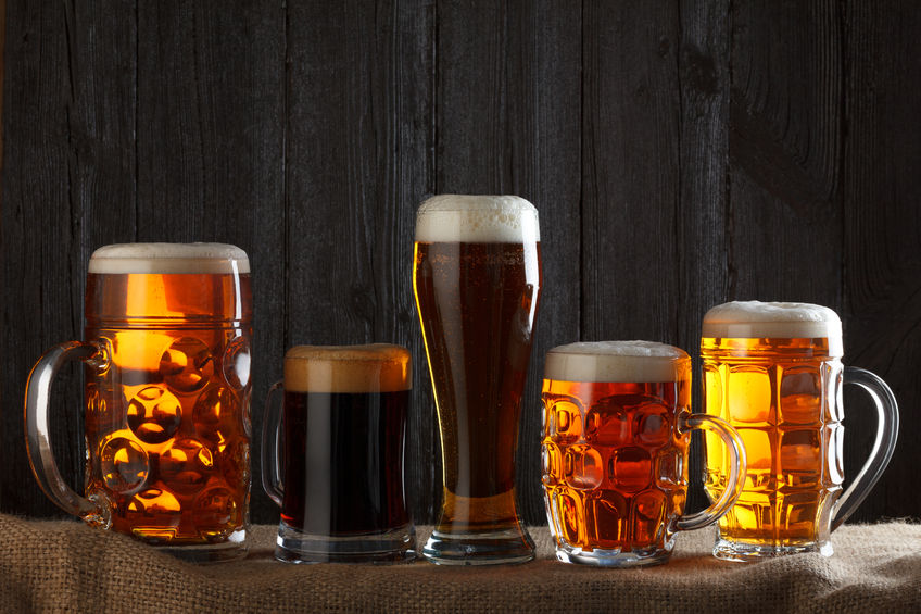 a photograph of different beers in various glass mugs