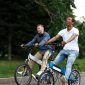 Two men on electric powered bicycles