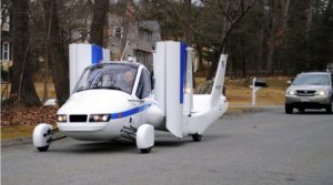 prototype flying car driving on road