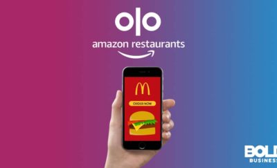 A phone with a McD app and Olo and Amazon logos