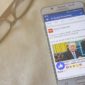 A phone with a Facebook news feed showing, The Trust Project is countering fake news!