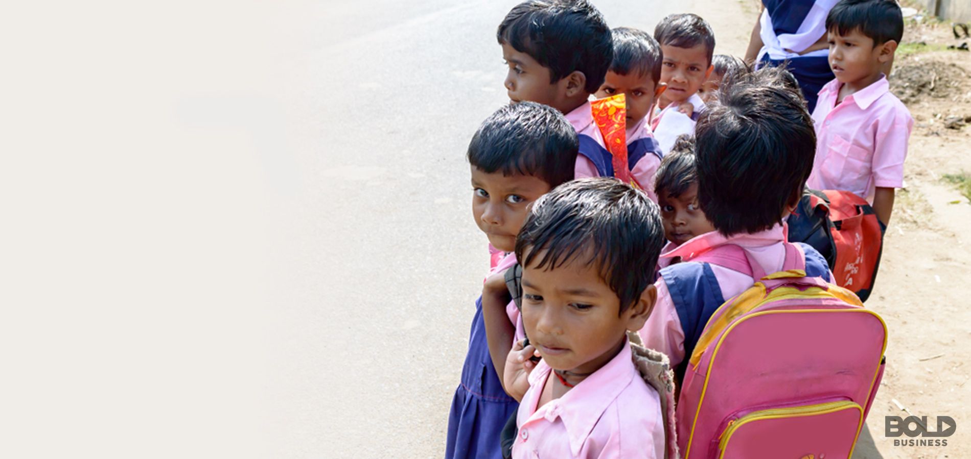 a group of children wearing backpacks and school uniforms - a picture of barriers to education