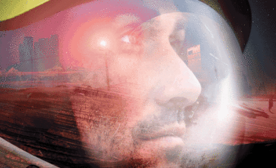 gif of astronaut in space looking at mars pondering