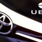 self-driving uber and toyota logo
