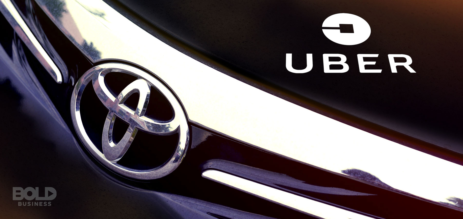 self-driving uber and toyota logo