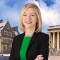 amy gutmann with the facade of upenn on the background
