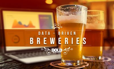 a photo of a beer with a laptop behind it in the thick of the rise of brewery analytics