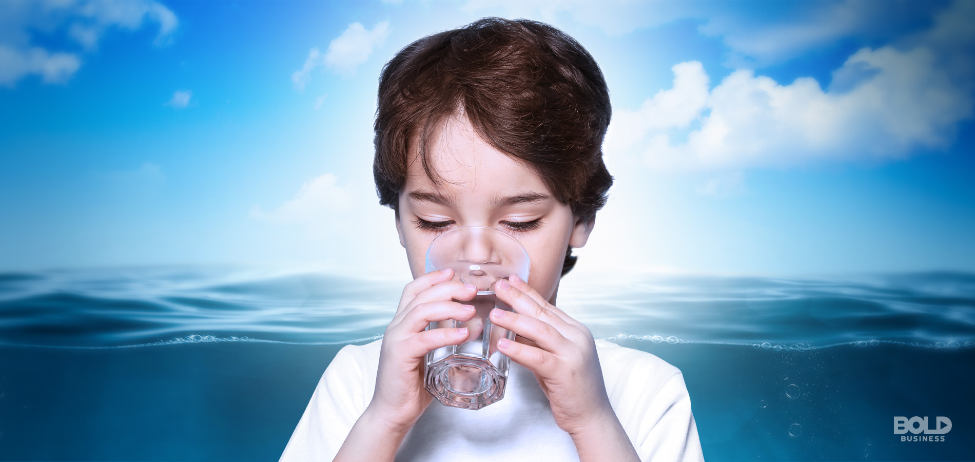 water desalination, child drinking water with the ocean as background