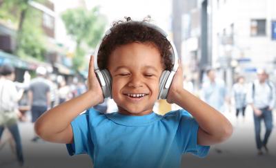 Kid listening to headphones, blocking out sound