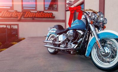 a photo of a Harley Davidson big bike parked in front of a Harley Davidson storefront amid the question of what a Harley Davidson rider might look like in the future