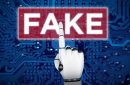 photo of an AI robot's hand pointing to the word FAKE embossed on a magnified part of a microchip amid fake reviews online