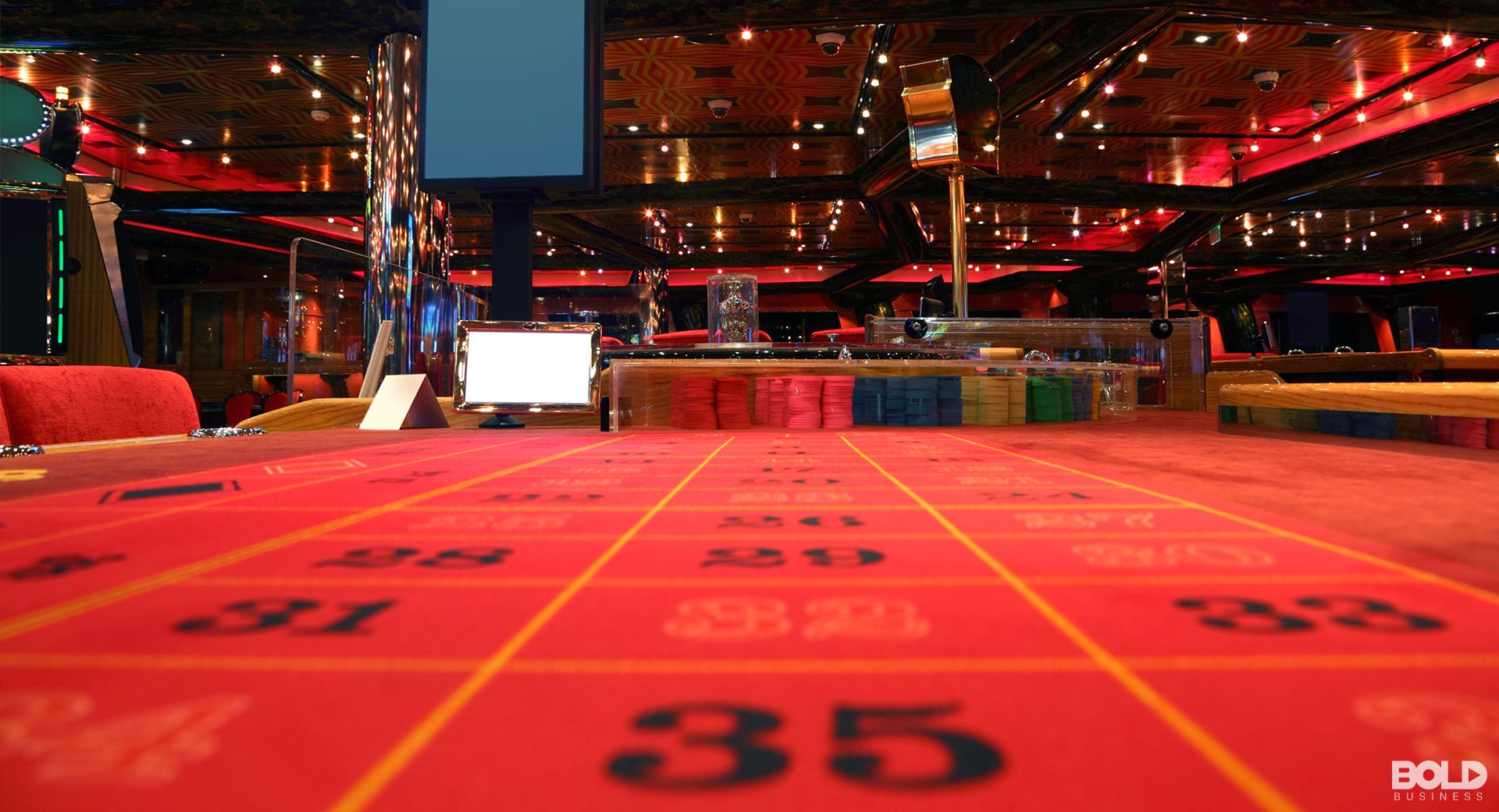 An empty casino view from the felt of a roulette board