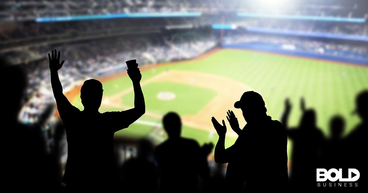Silhouettes of fans in the bleachers at a game