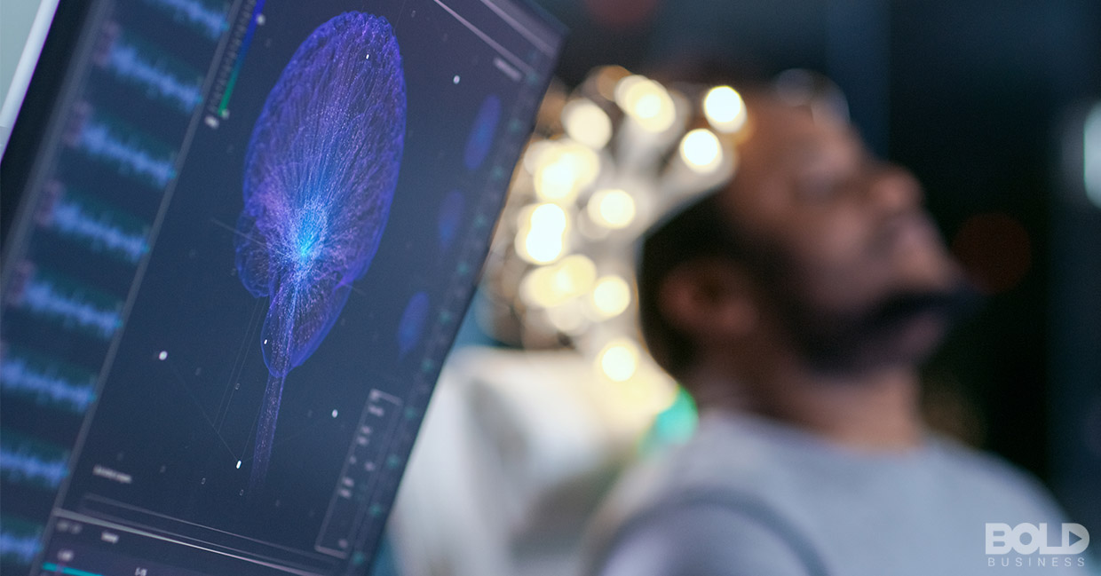 A person with their brain hooked up to a computer
