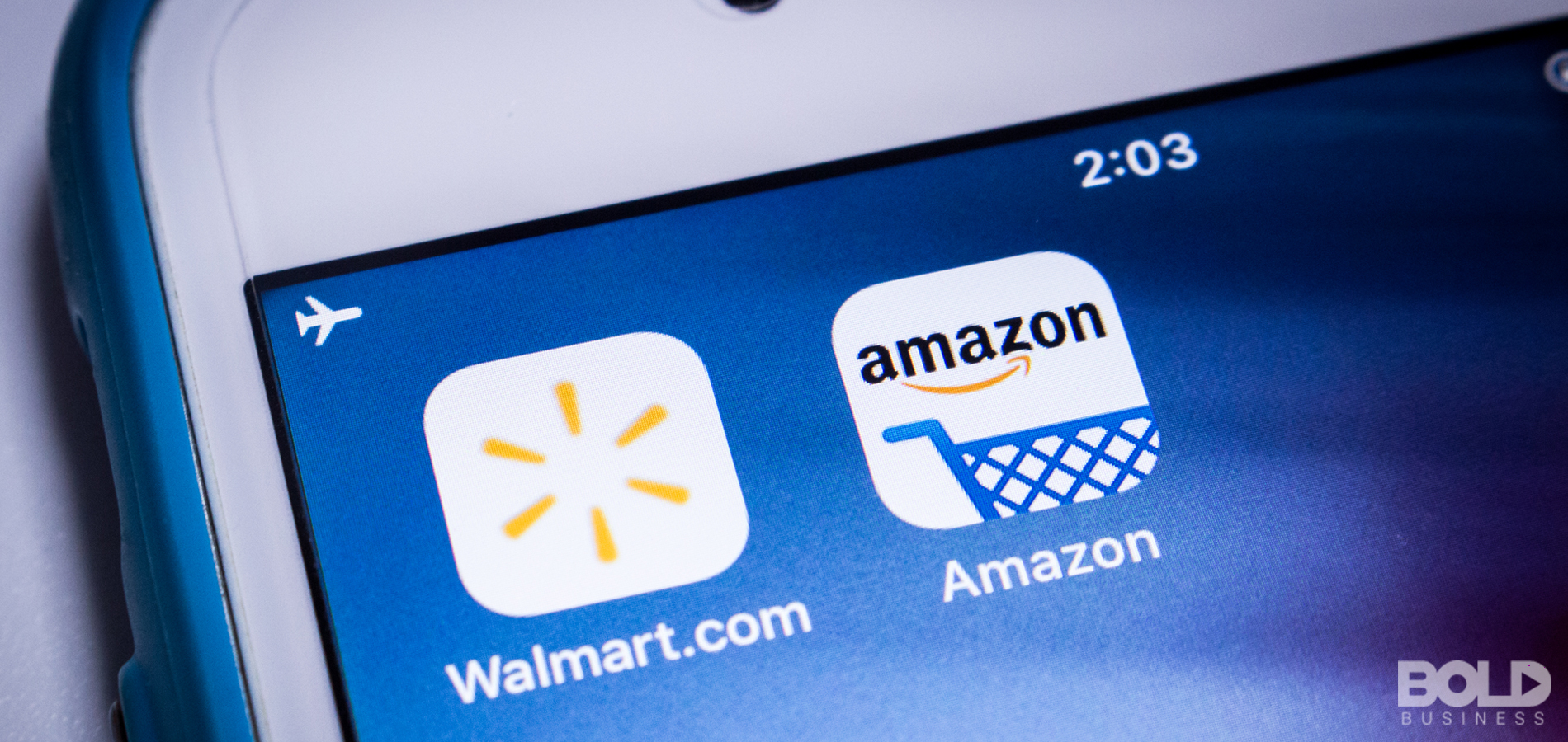 A phone with Walmart and Amazon shopping icons