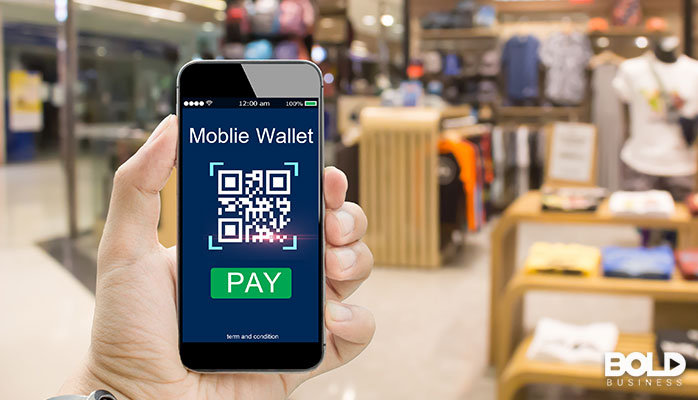 Someone holding up their digital wallet in their phone