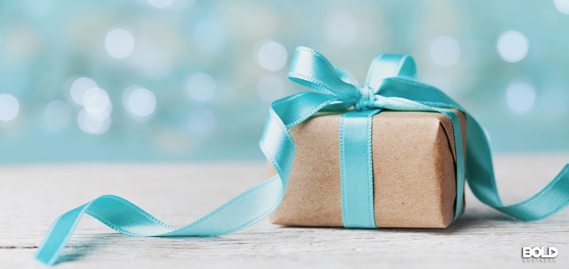 A gift wrapped up in a turquoise bow