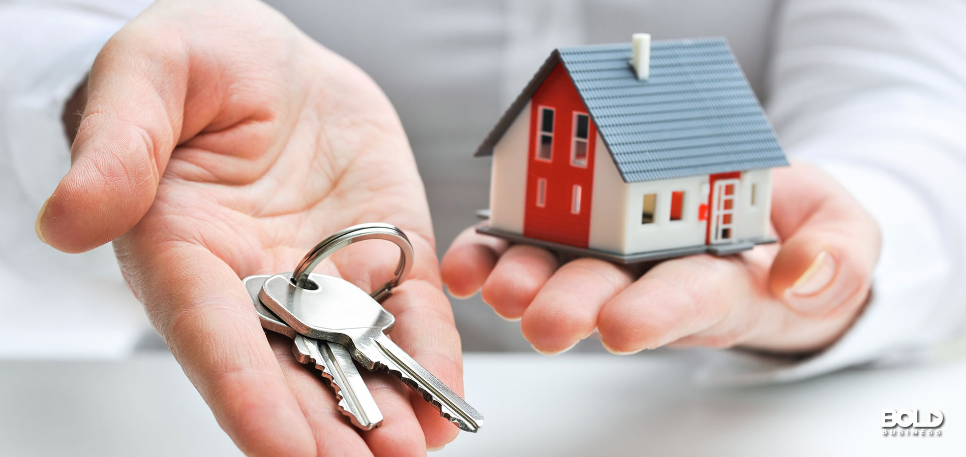 A giant holding a house and giant keys