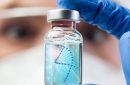 A doctor looking at a vial of giant DNA