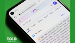 Someone using an AI content writer on their phone