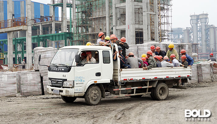 Some migrant workers in the back of a truck