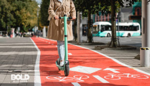 Someone riding instead of banning e-scooters