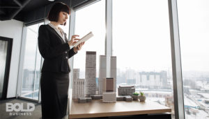 a woman contemplating commercial real estate